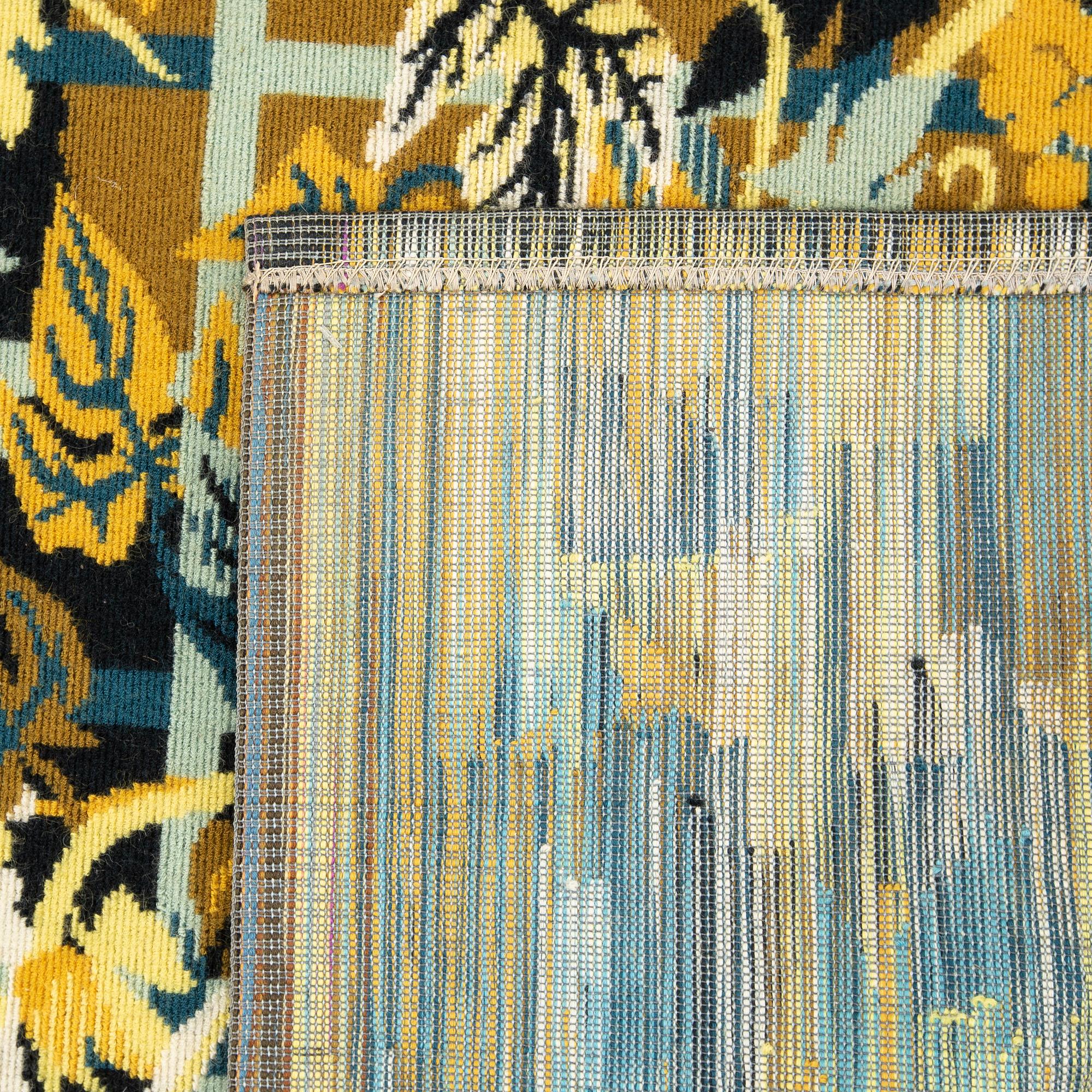 A wallhanging, machine-made, ca 99 x 157 cm, signed Hervé Lelong, J.F.D.