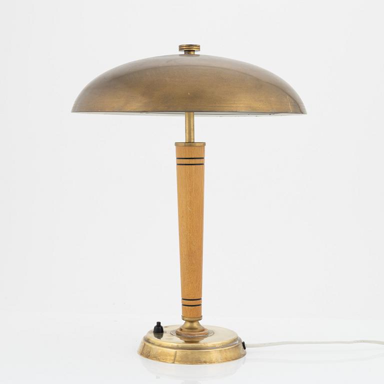 A Swedish Morden brass and elmwood table light, 1940's.