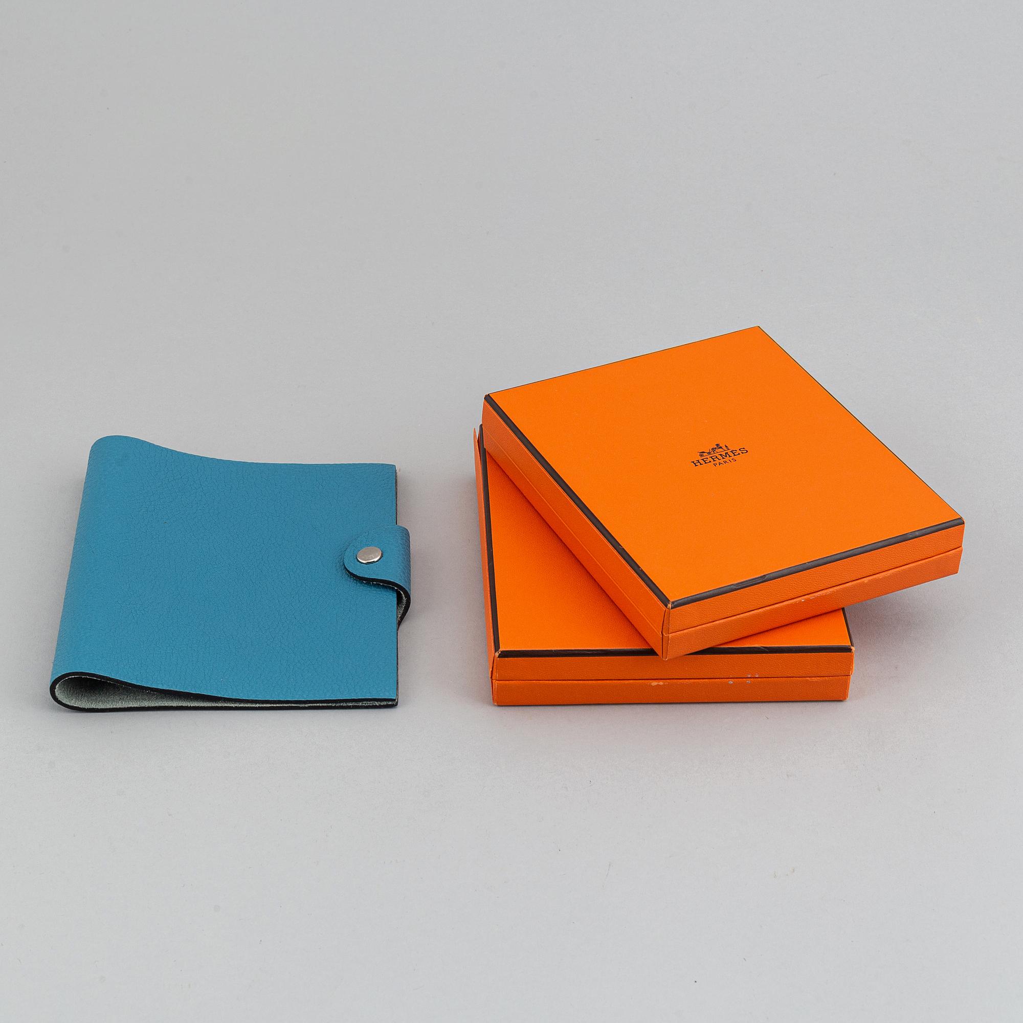 Hermès, a blue leather notebook with two scripple pads.