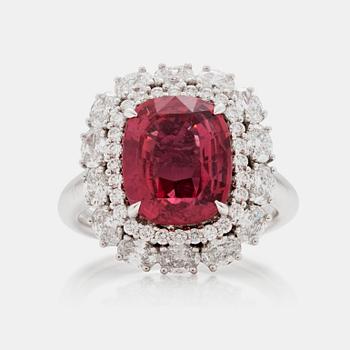 605. A 5.12 ct unheated red-orange sapphire and brilliant cut diamond ring. Total carat weight of diamonds circa 1.48 cts.