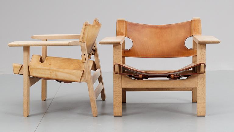 A pair of Børge Mogensen 'The Spanish Chair' in oak and leather by Fredericia Stolefabrik, Denmark.