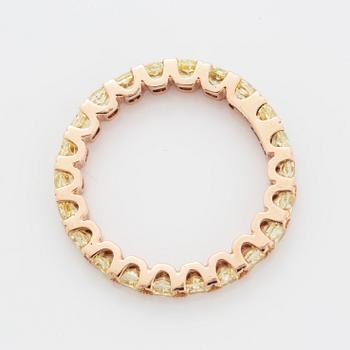 Cushion-cut yellow diamond eternity ring.