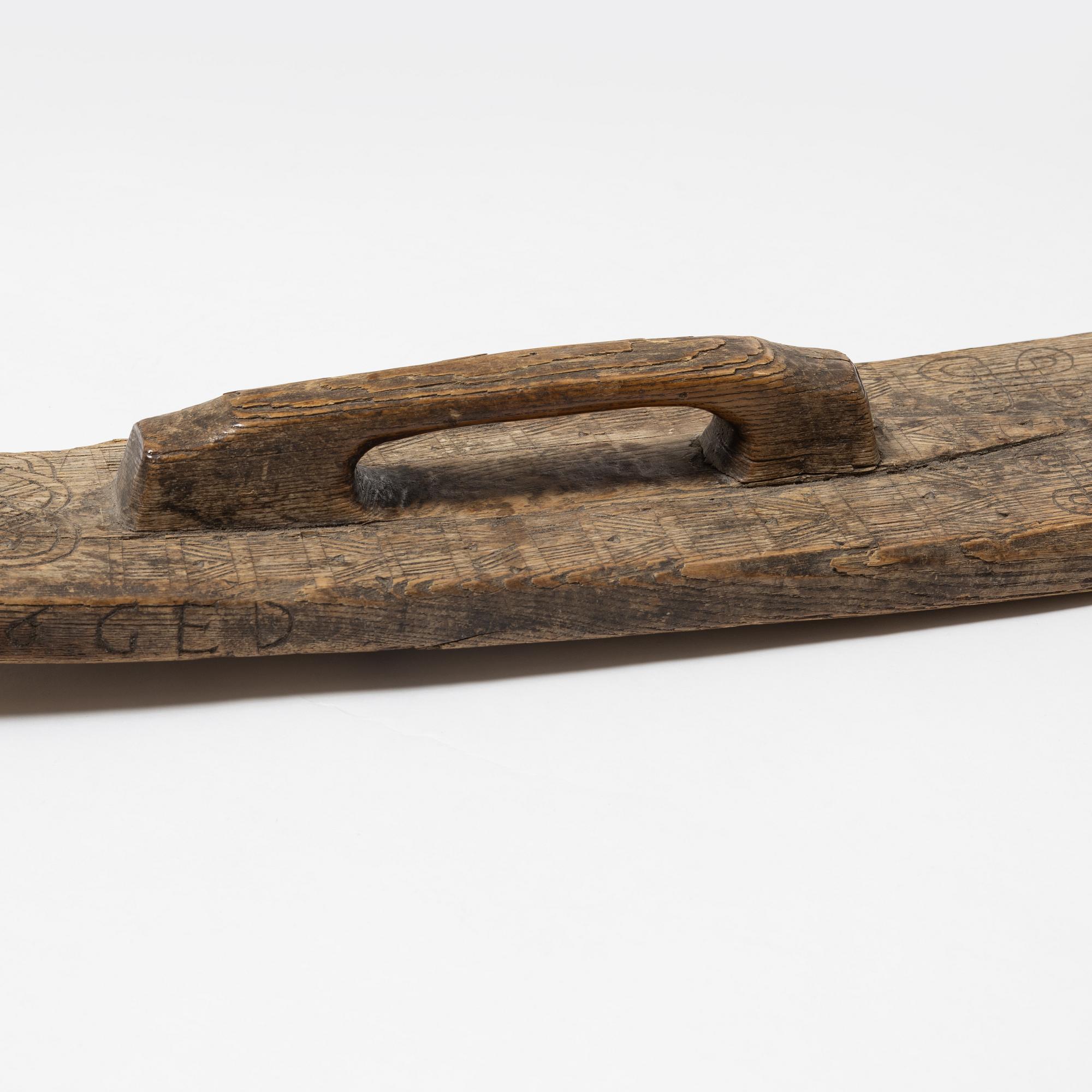 A Swedish folk art mangle board, dated 1666.