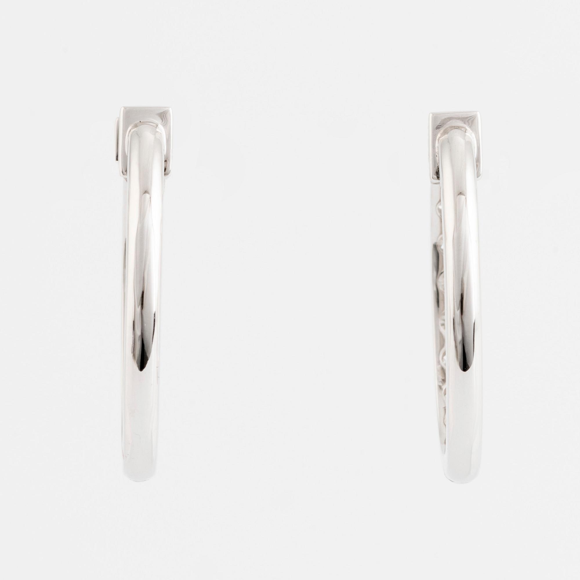 Brilliant cut diamond hoop earrings.