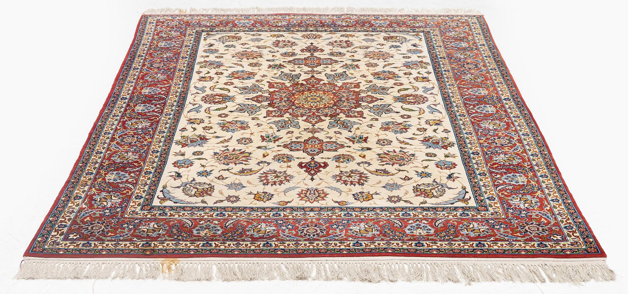 A semi-antique Isfahan rug, c. 225 x 143 cm.