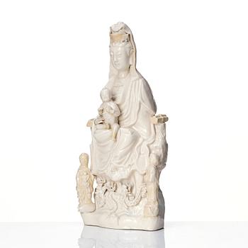 789. A Chinese blanc de chine Guanyin with attendants, Dehua, late Ming dynasty/early Qing dynasty.