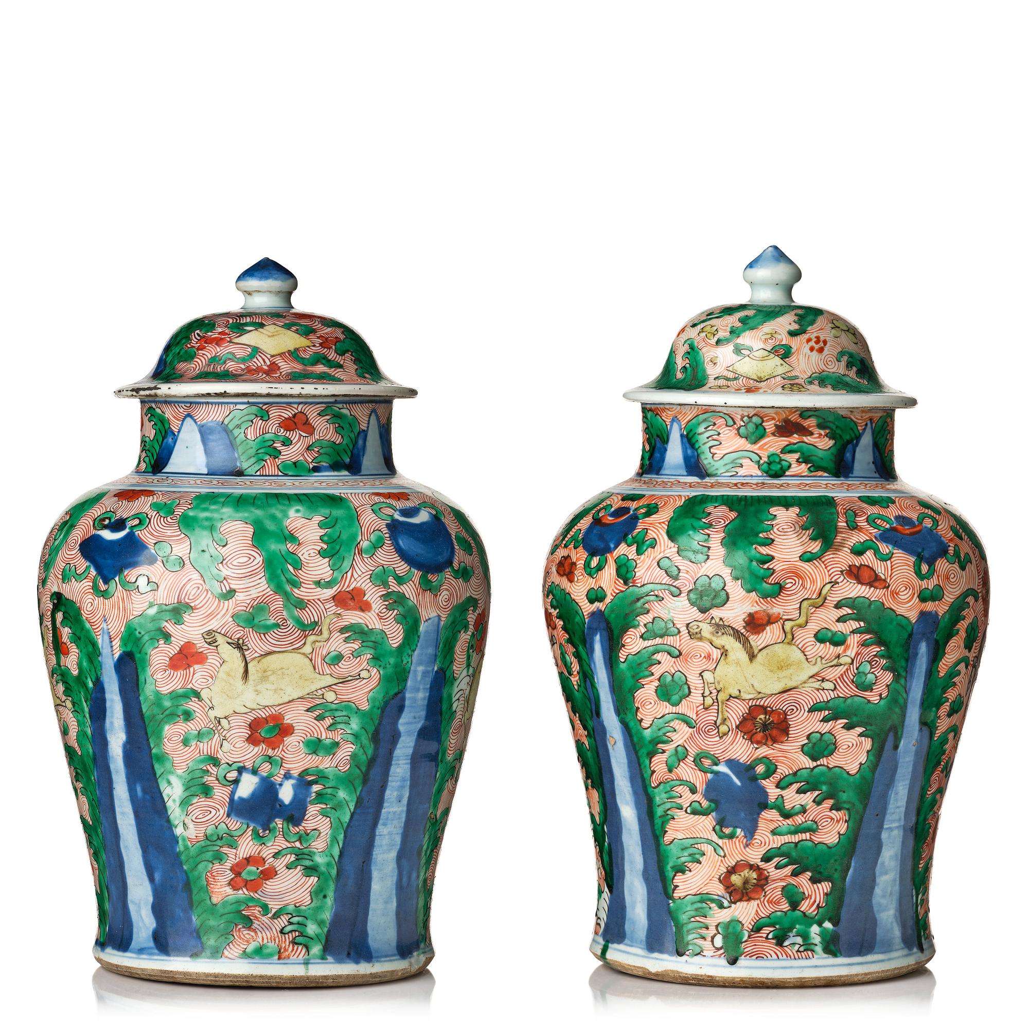 A pair of Transitional Wucai jars, 17th Century.