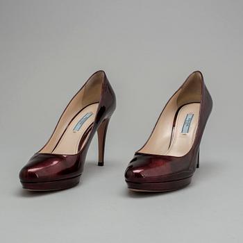 a pair of pumps by Prada, in size 39.