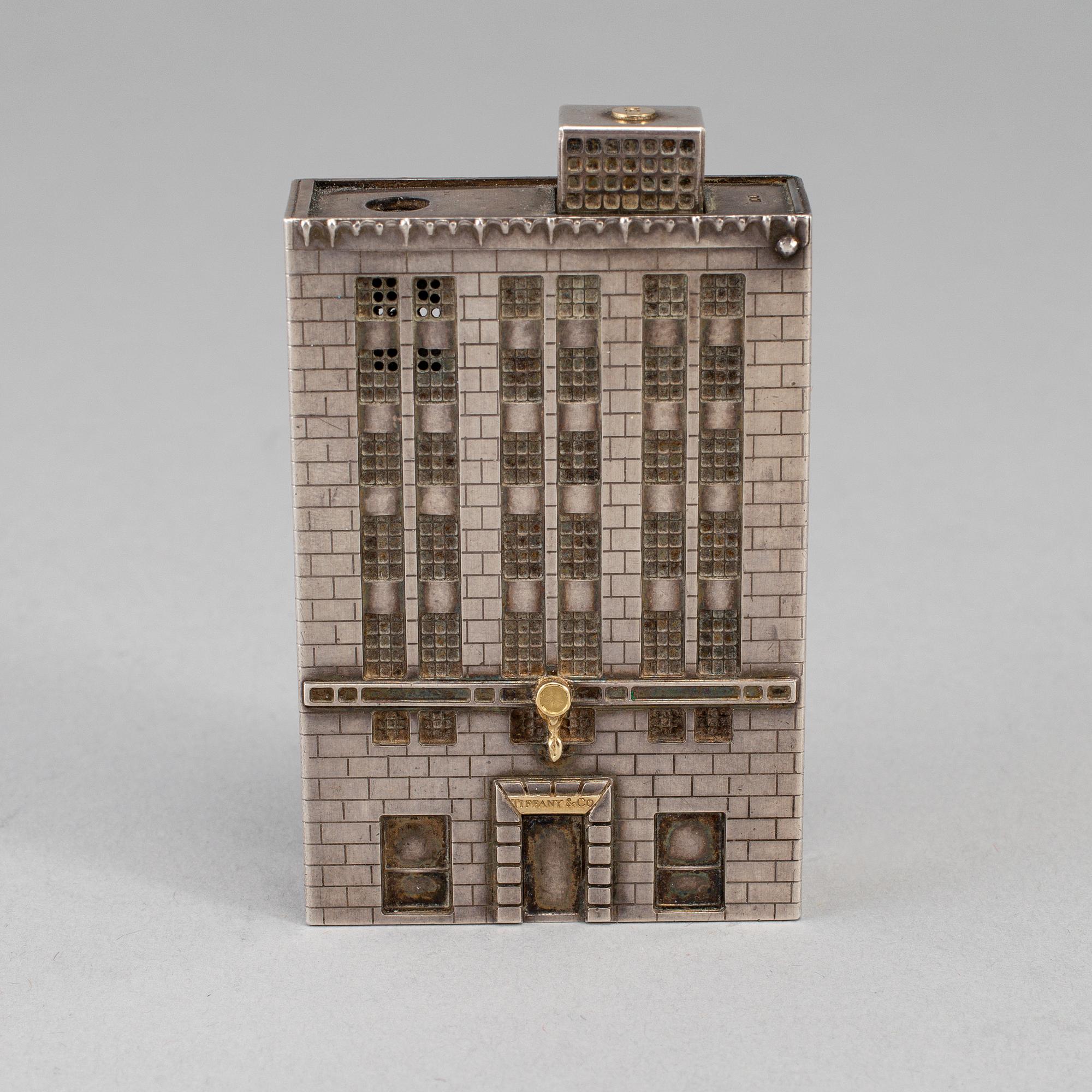 A Tiffany & Co. silver cigarette-lighter, marked London 1970.