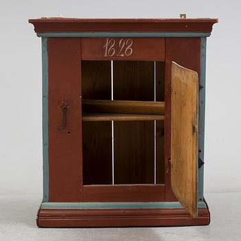 a painted cabinet dated 1828.