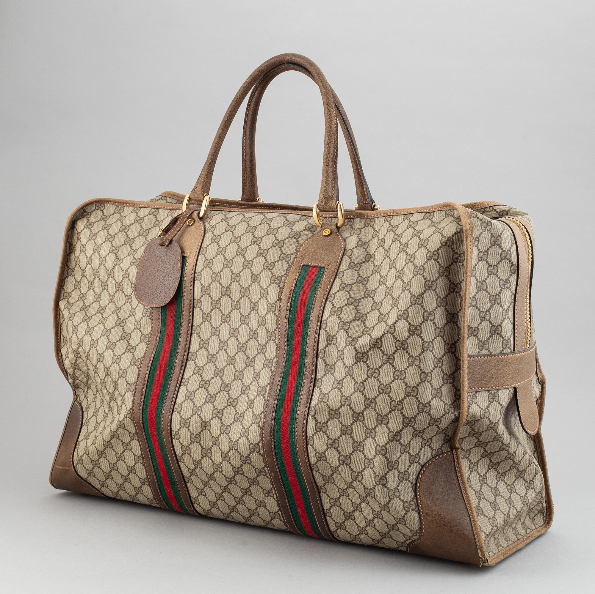 Gucci, a canvas weekend bag.