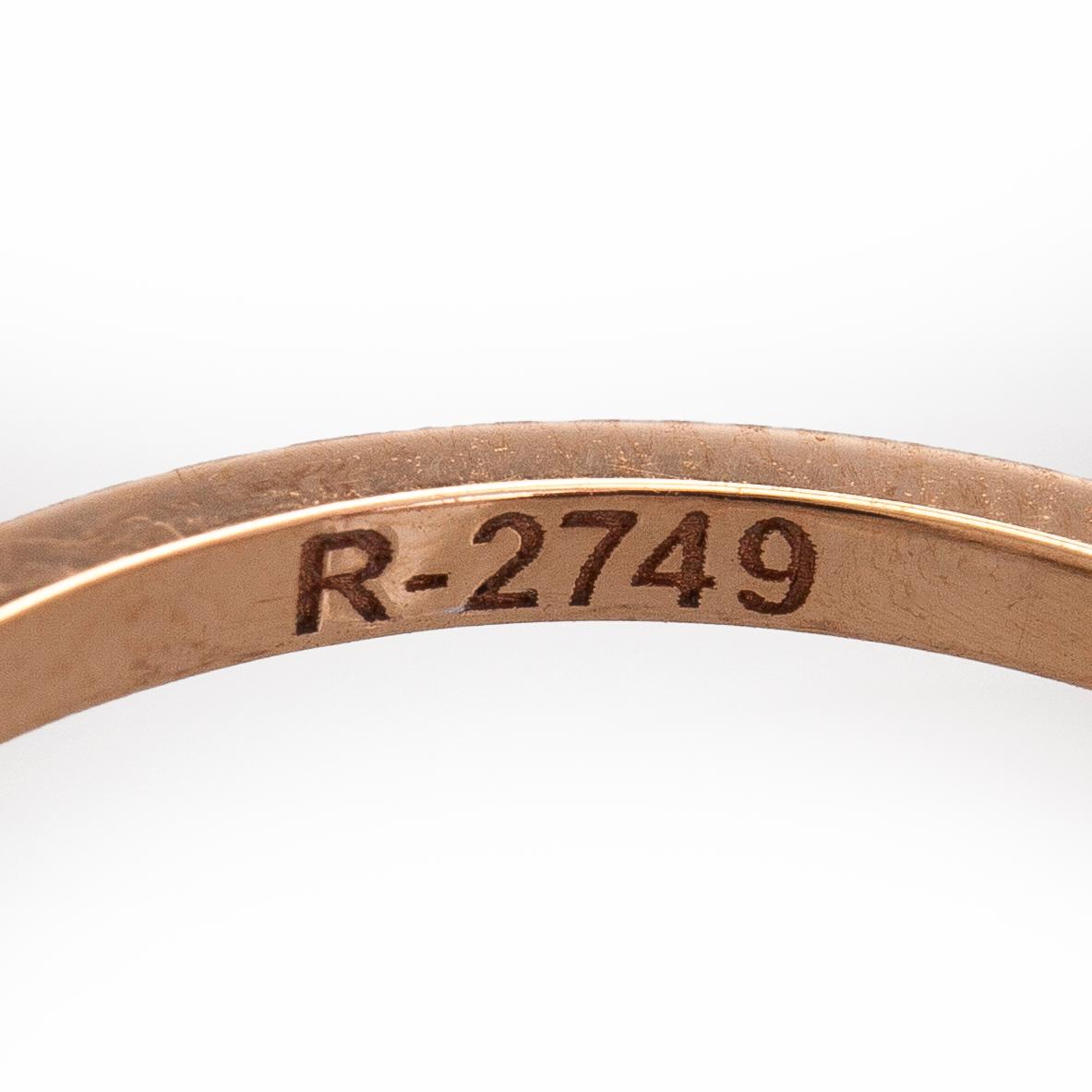 Ring, three baguette cut diamonds, small brilliant cut diamonds, 18K white gold and rose gold.