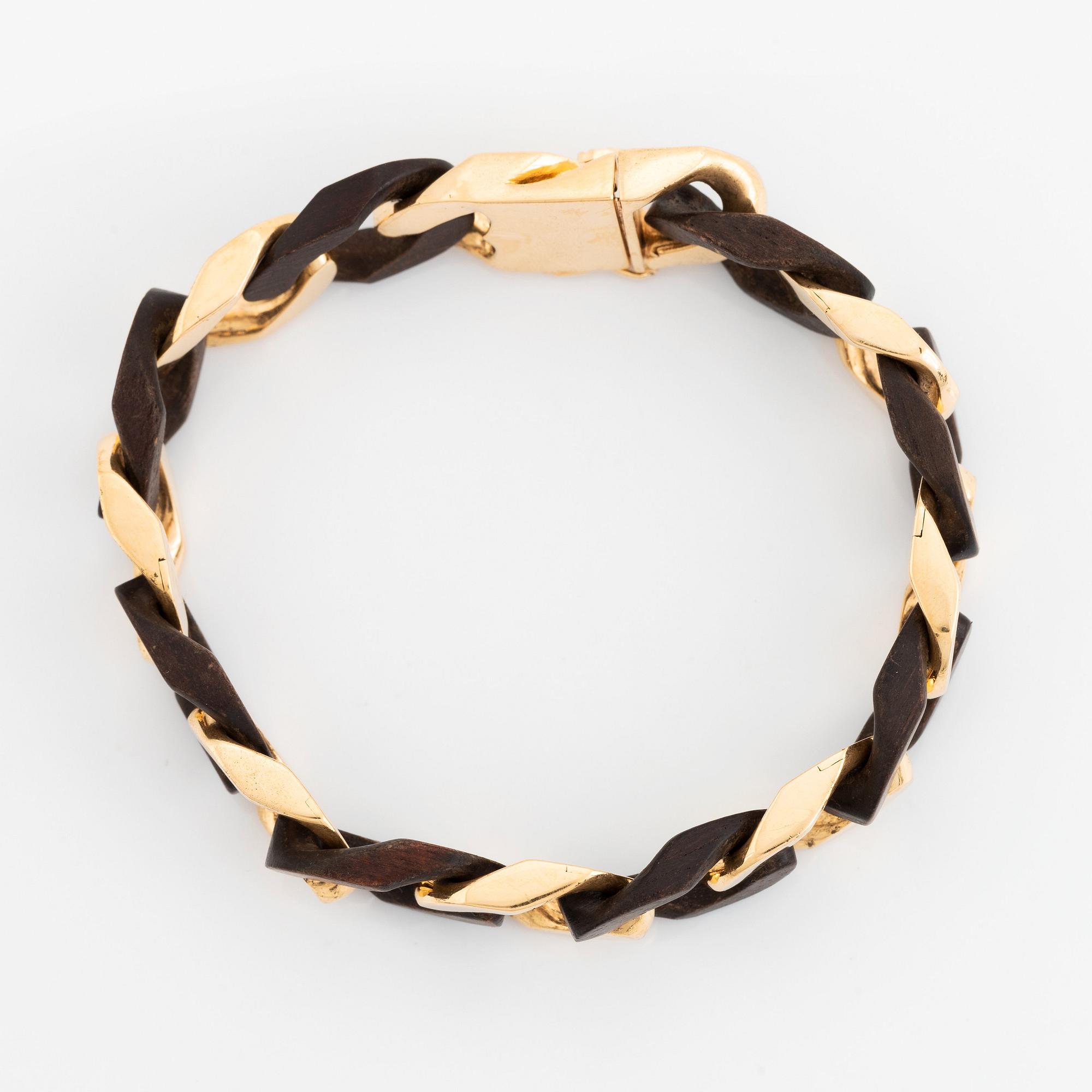 A Van Cleef & Arpels 18K gold and wood bracelet.