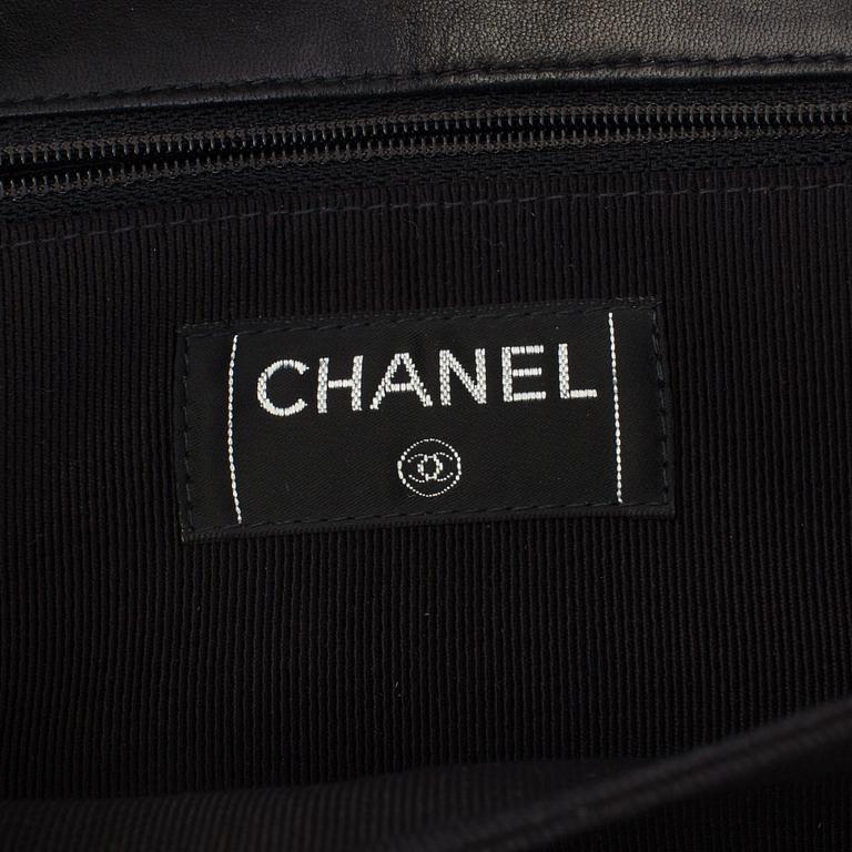 A bag CHOCOLATE BAR REISSUE by Chanel.