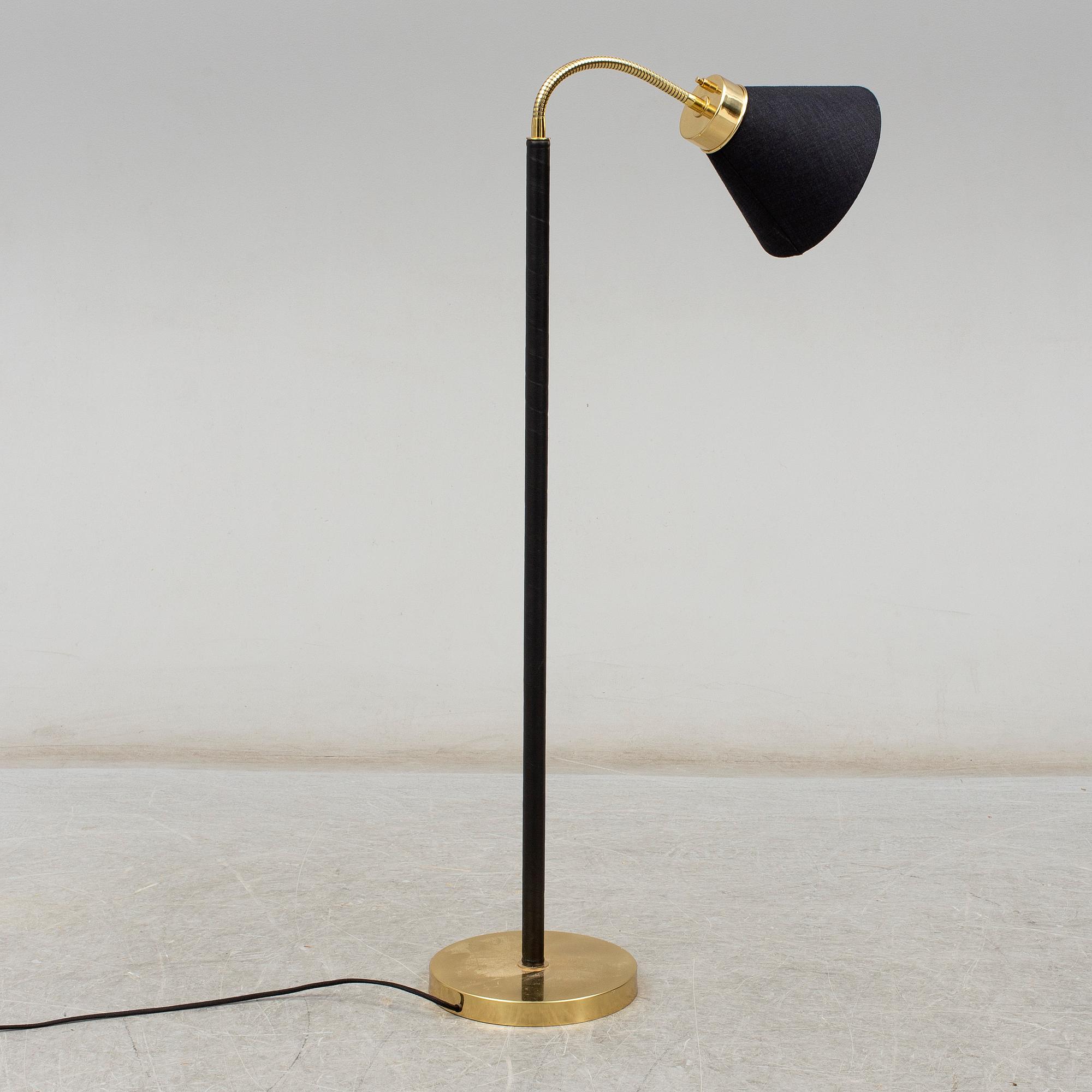 JOSEF FRANK, a brass and leather wrapped floor lamp, model 1838, from Firma Svenskt Tenn.