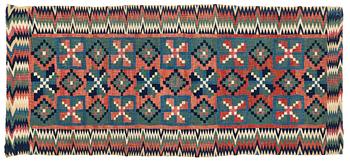 318. A carrige cushion, "Åttabladsstjärnor", flat weave, ca 46,5 x 104 cm, Scania, 1780 to 1820.