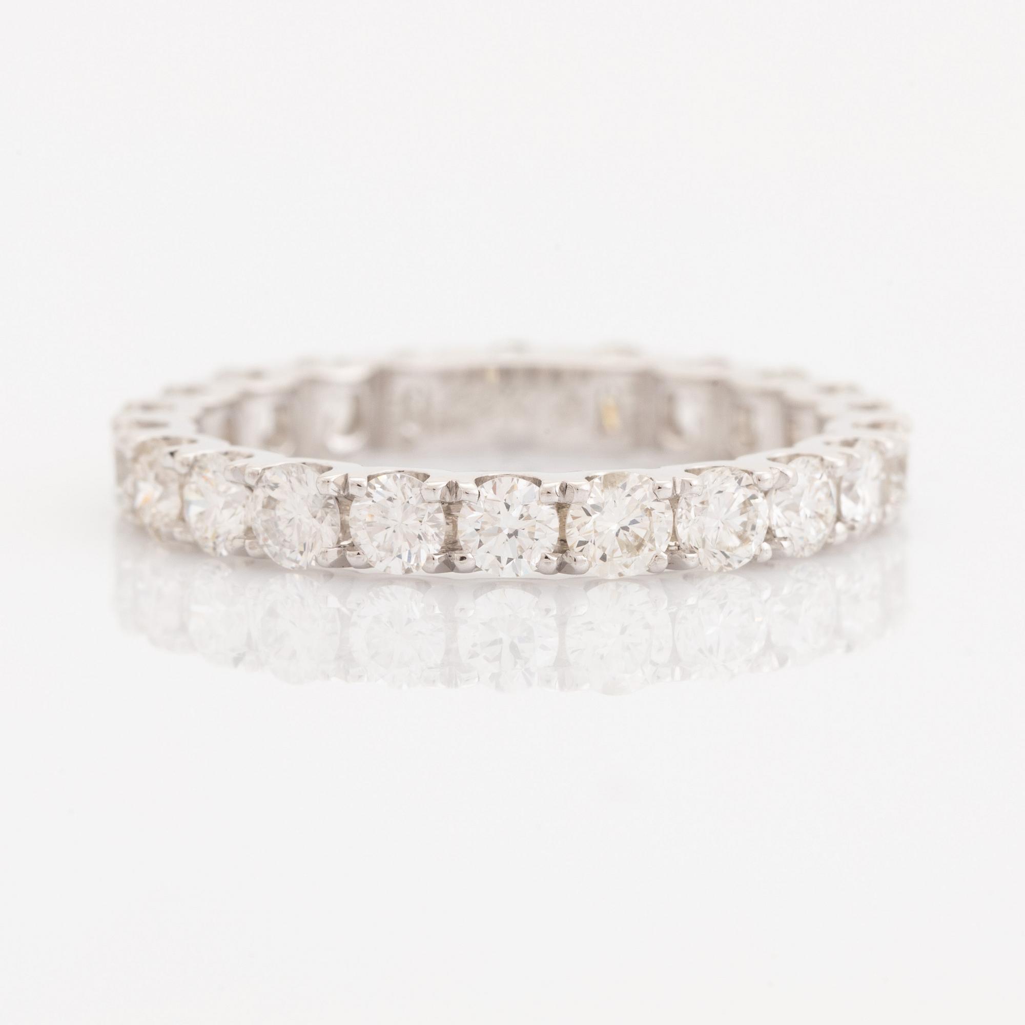 Brilliant-cut diamond eternity ring.