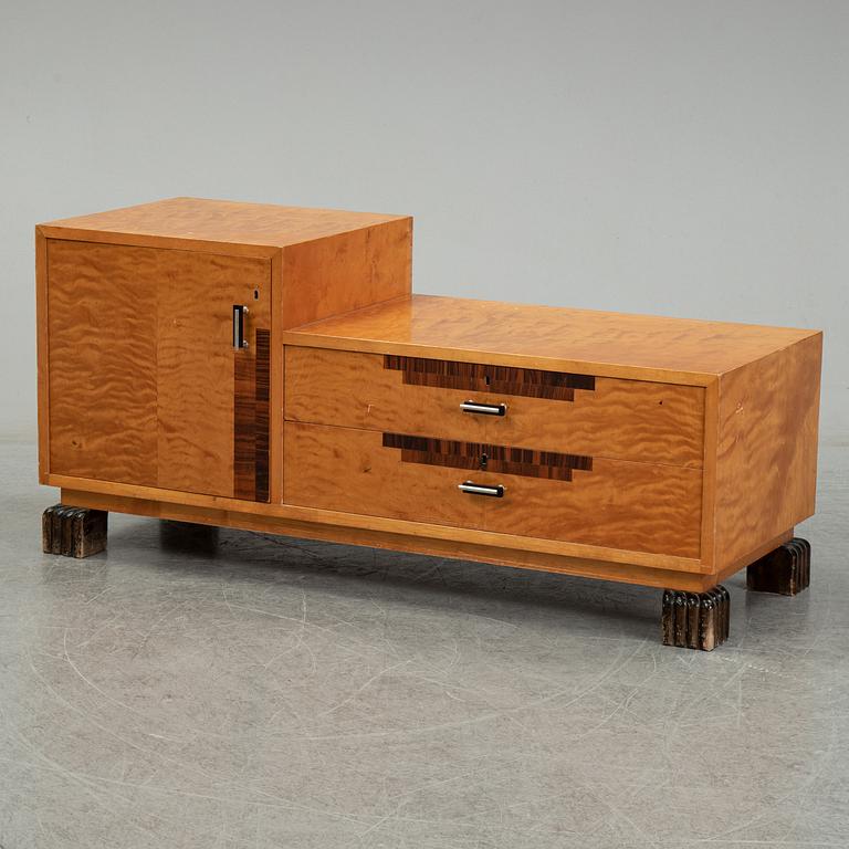 A dressing table with mirror and two chairs, 1930's.
