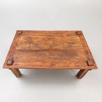 A wooden coffee table later part of the 20th century.
