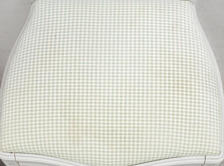 A Gustavian style dining table and ten chairs, 20th century.