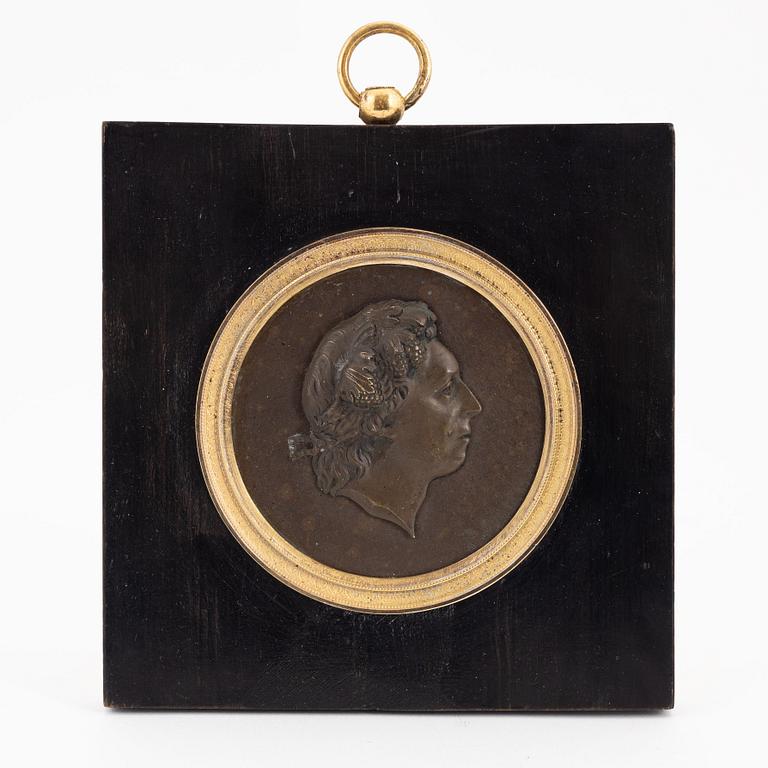 An Empire ormolu and patinated bronze portrait medallion depicting Carl Michael Bellman, early 19th Century.