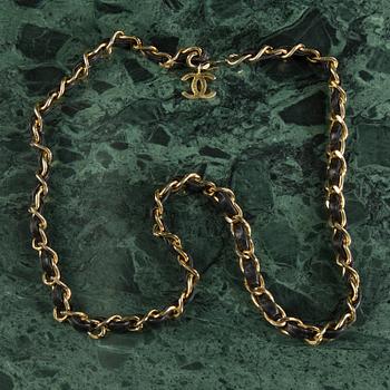 Belt with mini flap-bag by Chanel.