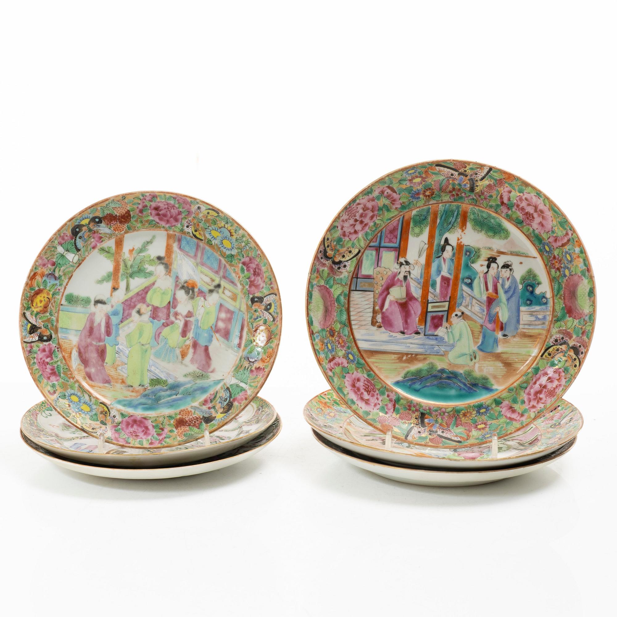 A matched set of 14 famille rose 'Canton' dinner plates, Qing dynasty, 19th century.