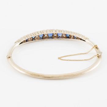 Arm ring of low carat gold with sapphires and old-cut diamonds.