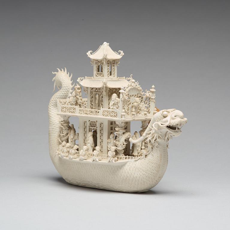 A biscuit porcelain dragon boat of 'Assembly of Immortals', Qing dynasty, Daoguang, signed Chen Guozhi, 19th century.