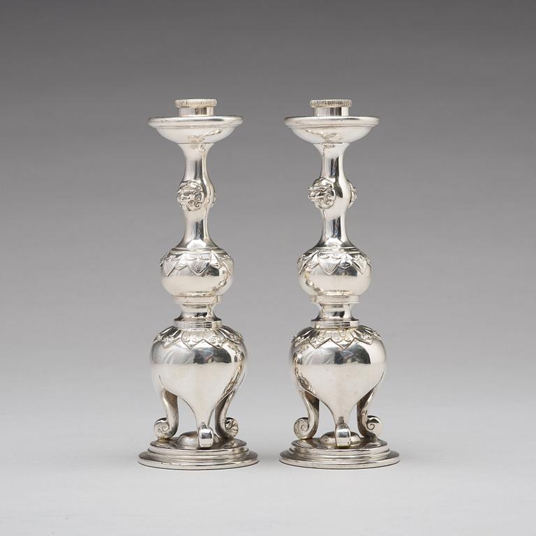 A pair of Chinese silver candle sticks, Shanghai, early 20th Century.