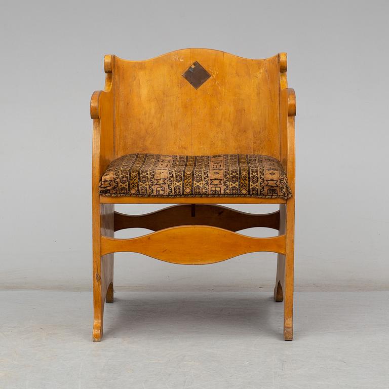 An early 20th century birch armchair.