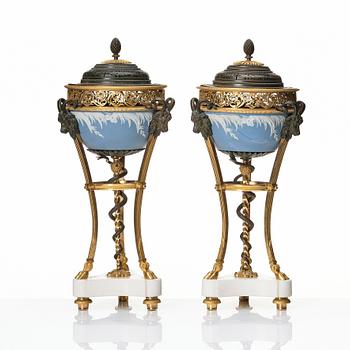 A pair of gilt bronze, marble and ceramic potpourri urns with covers, 19th century.