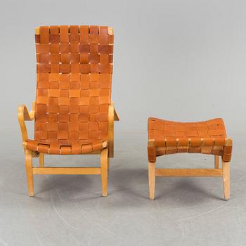 An easy chair with stool by Bruno Mathson.