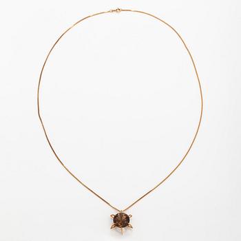 A 14K gold necklace with a smoky quartz. Martti Tapio Aarnio, Helsinki 1966.