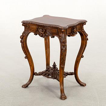 A NEO ROCOCO SMALL TABLE.