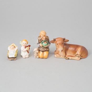 A set of 13 porcelain and wood christmas manger.