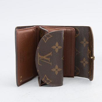 An 'Helene' wallet by Louis Vuitton.