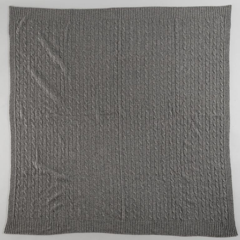 A cashmere blanket by Ralph Lauren.