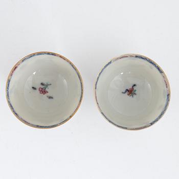 Twelve Chinese famille rose cups on stands, Qing dynasty, Qianlong (1736-95).