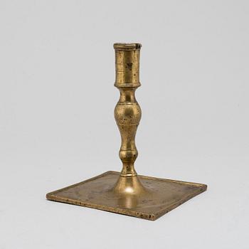 A Baroque brass candlestick, early 18th century.