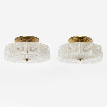 Carl Fagerlund, a pair of brass and glass ceiling lights, Orrefors.