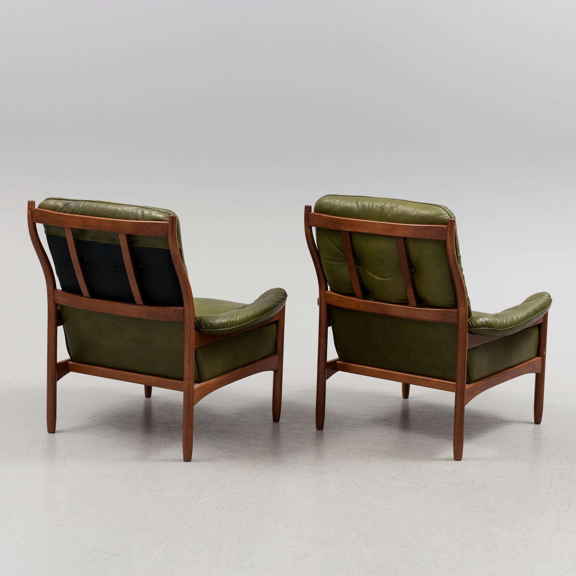 A pair of stained beech and leather easy chairs from Göte Möbler, Nässjö, second half of the 20th century.