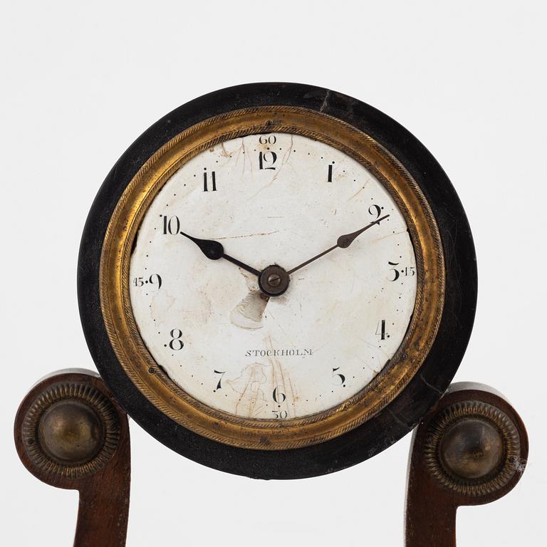 An Empire mantle clock from the 19th century.