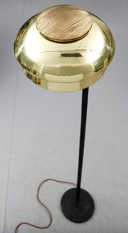 An Alvar Aalto 'A 808' brass and black leather floor lamp, Valaisinpaja, Finland late 1970's.