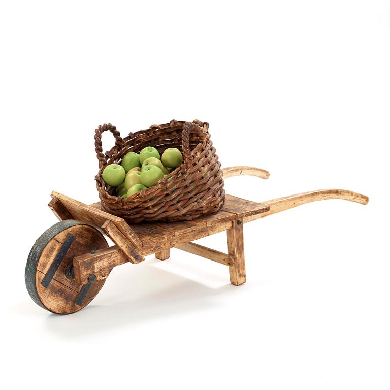 Ingrid Herrlin, a stoneware basket with 30 apples and a wheelbarrow, Sweden ca 1988.