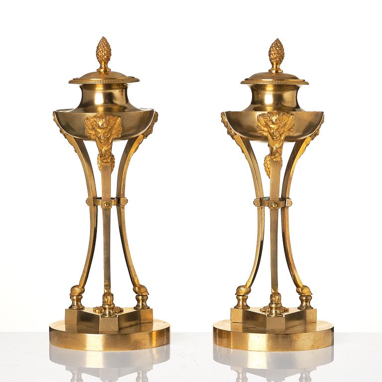 A pair of Empire tripod shaped casolettes.