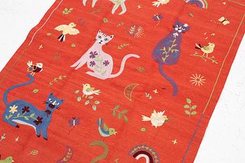 A hand-embroidered Kilim rug, c. 182 x 122 cm.