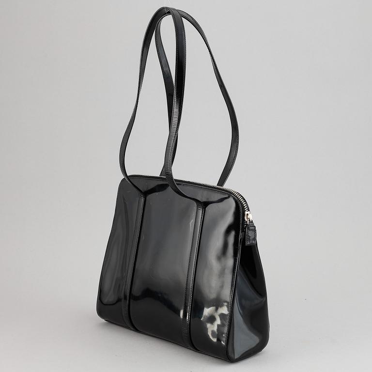 Prada, a patent leather bag.
