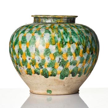 A sancai-glazed pottery jar, Tang dynasty (618-907).