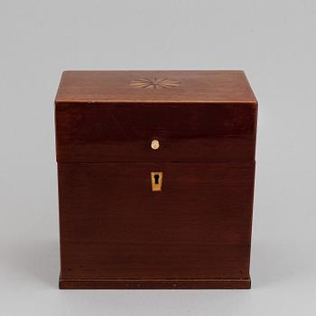 A late Empire mahogany box with three glass bottles, mid 19th Century.